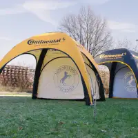 Continental event tents with yellow and black branding and logo