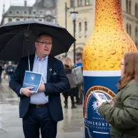 Public engagement and dialogue event featuring a 3-meter high inflatable advertising bottle