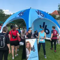 Event tent for running races with V6 chewing gum branding and logo